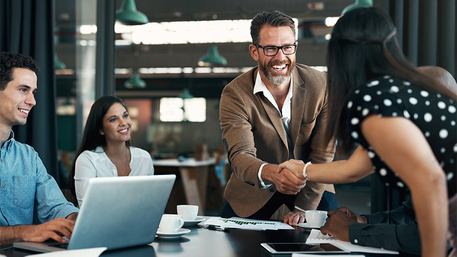 Business people meeting and handshake for partnership, b2b contract deal or woman inclusion promotion. Corporate team, manager shaking hands in office for commitment, onboarding or client negotiation